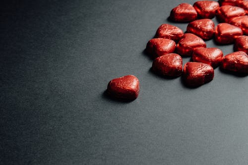 Free Red Heart Shaped Candies on Gray Background Stock Photo