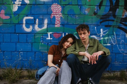 A Couple Sitting on the Ground