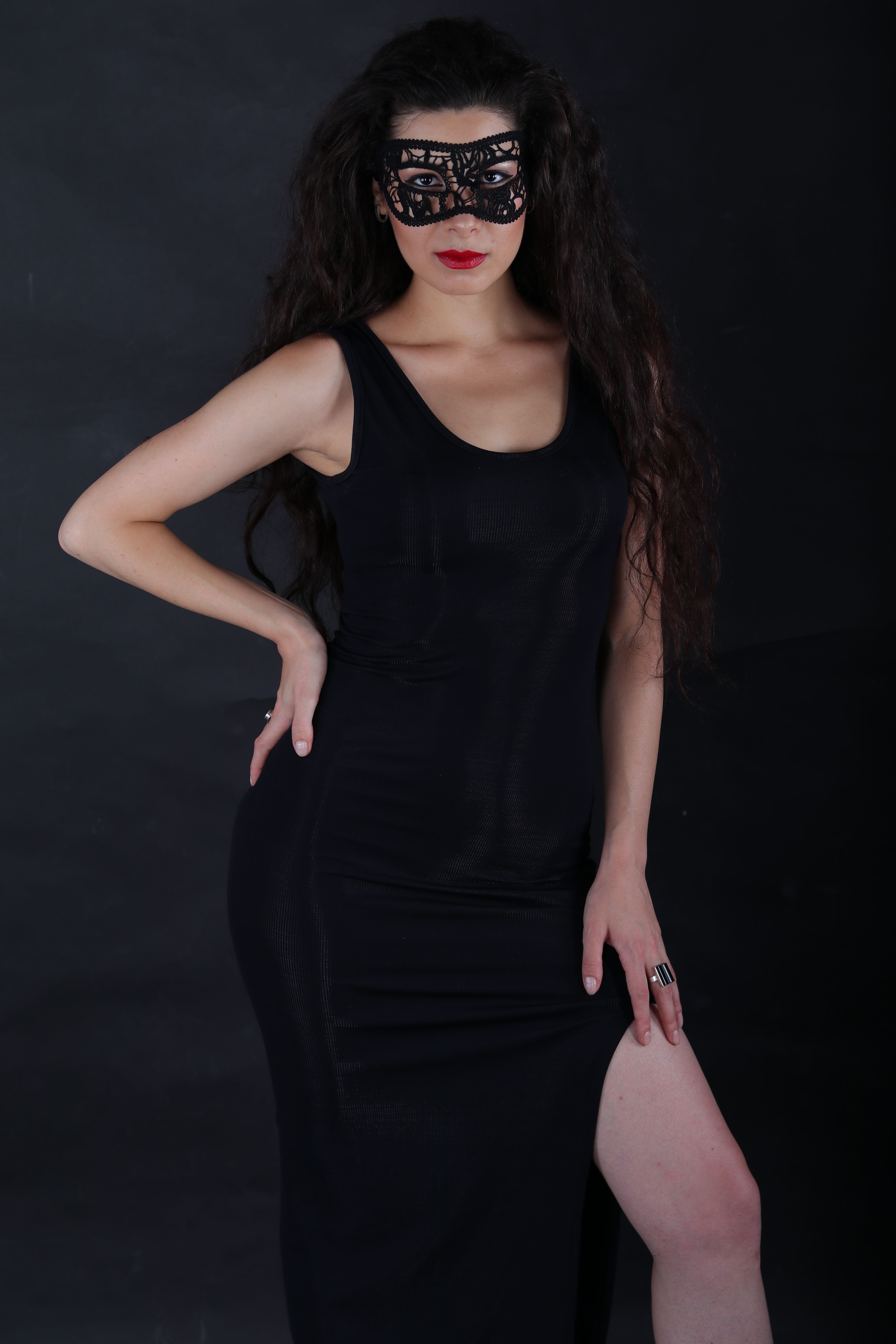 A Woman in Black Dress Wearing Black Mask · Free Stock Photo