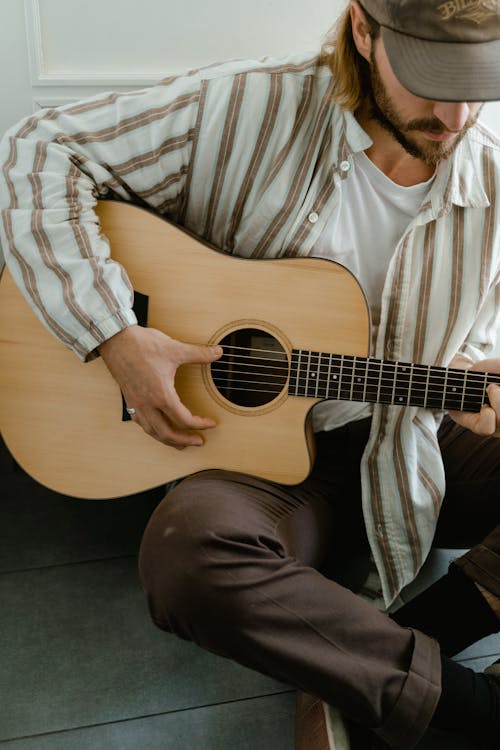 Free Man Playing Acoustic Guitar Stock Photo