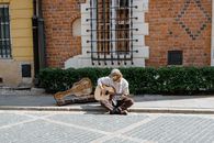 Man Playing Brown Acoustic Guitar