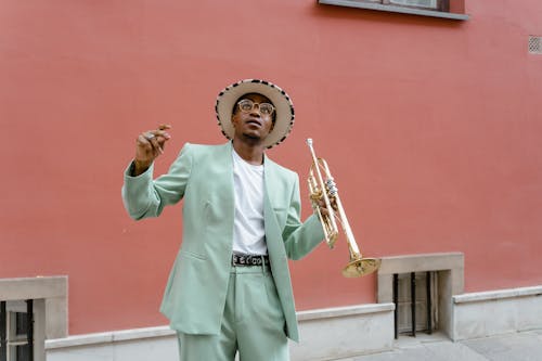 Man in Suit Playing Trumpet