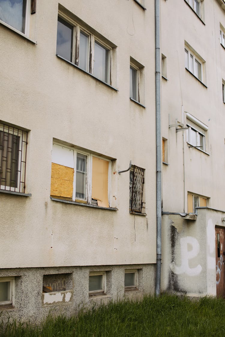 White Concrete Building Near Green Box