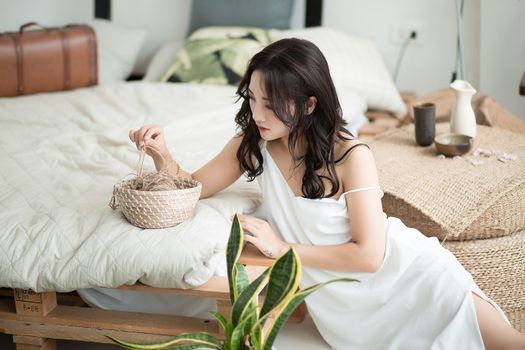 A Beautiful Women in Her Nightwear Holding a String