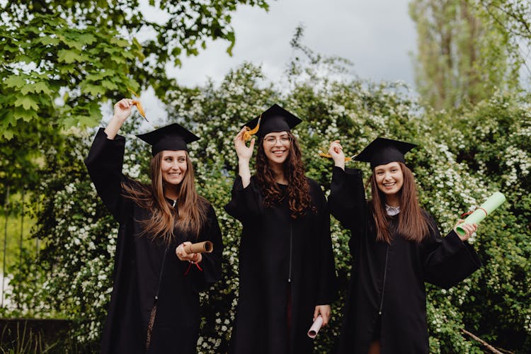 Young Graduates In Their Academic Dress