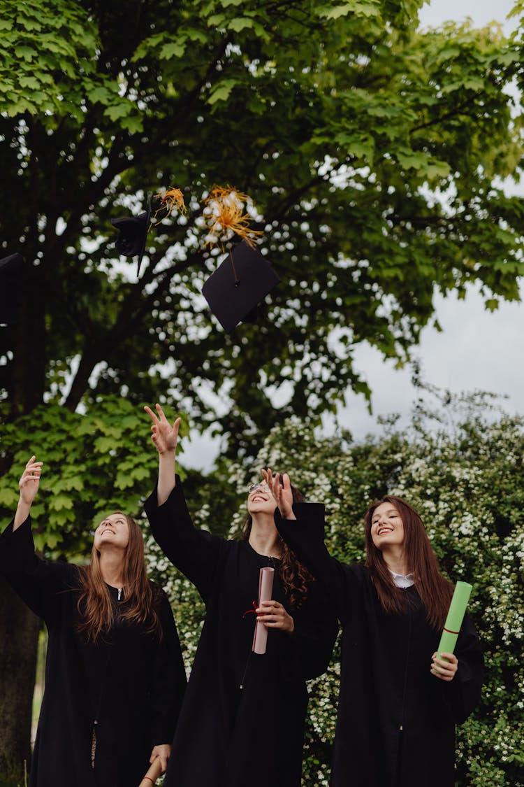 Women Throwing Graduation Hats