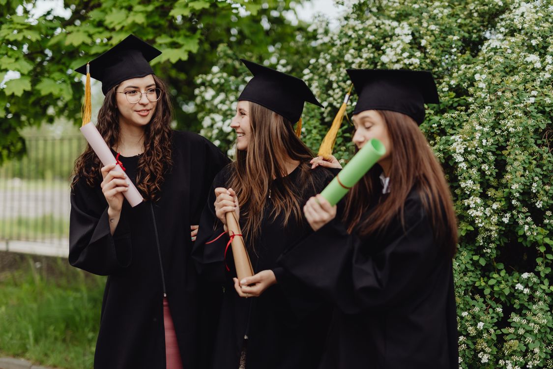 Women Wearing Graduation Hats Holding Diplomas · Free Stock Photo