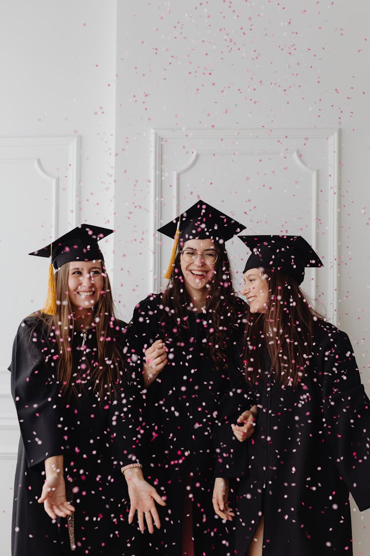 Young Graduates And Falling Confetti