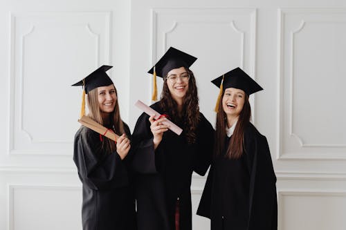 Free Happy Women in Academic Dress Stock Photo