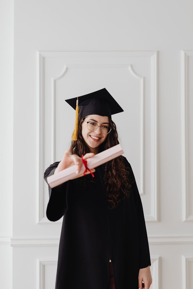 A Woman Holding A Diploma