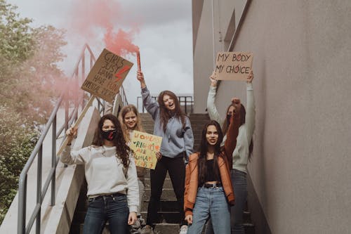 Women Protesting and Holding Placards