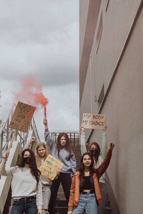 Women Protesting and Holding Placards