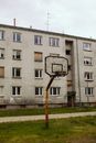 Brown Basketball Hoop Near White Concrete Building