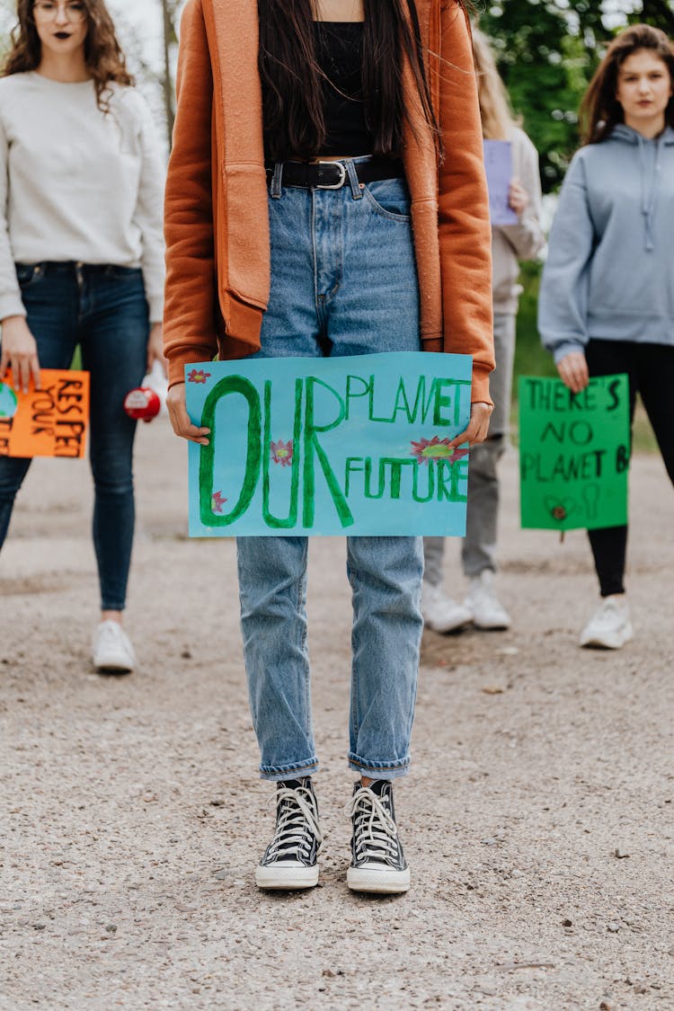 A Woman Holding A Placard