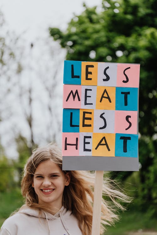 Free Young Woman holding a Placard Stock Photo