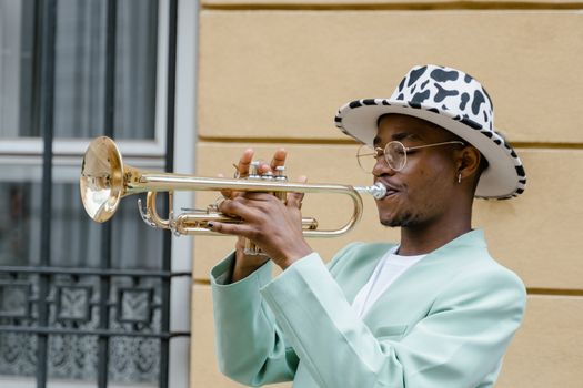 Man in Suit Playing Trumpet