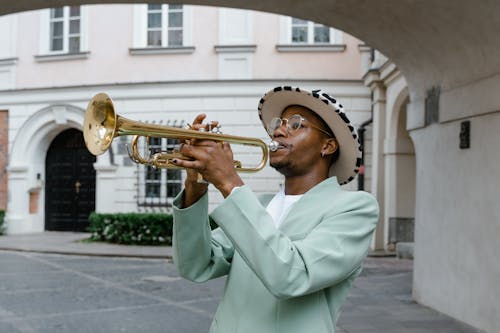 Man in Suit Playing Trumpet