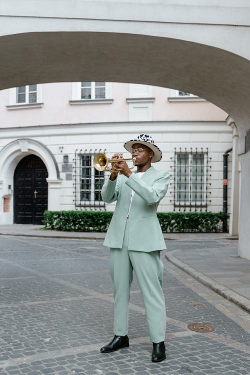Man in Suit Playing Trumpet
