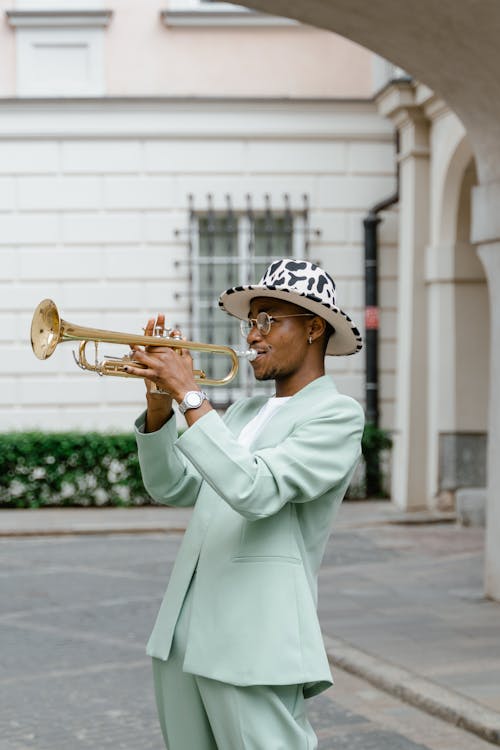 Man in Suit Playing Trumpet