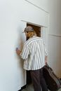 Man Turning Off Light Switch