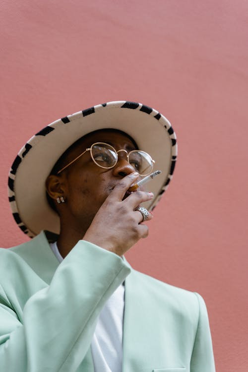 Man in Suit Smoking Cigarette