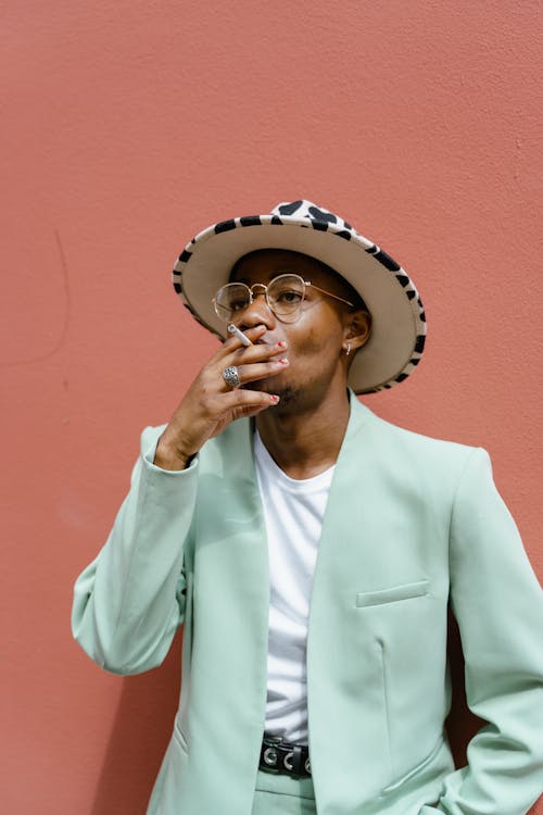 Man in Suit Smoking Cigarette · Free Stock Photo