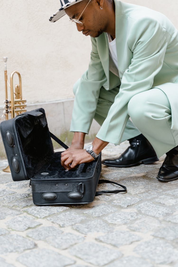 Man With Black Trumpet Case