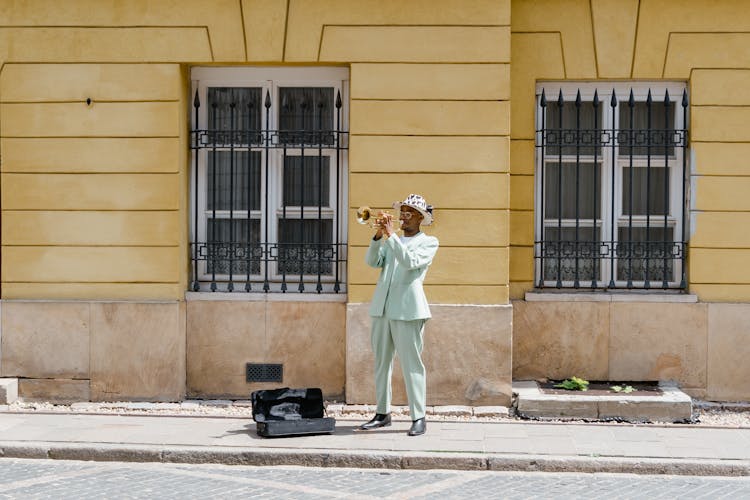 Man Playing The Trumpet In The Street