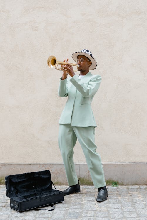 Man in Teal Suit Playing Trumpet
