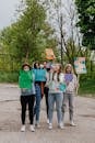 3 Women Holding Banner Standing on Road