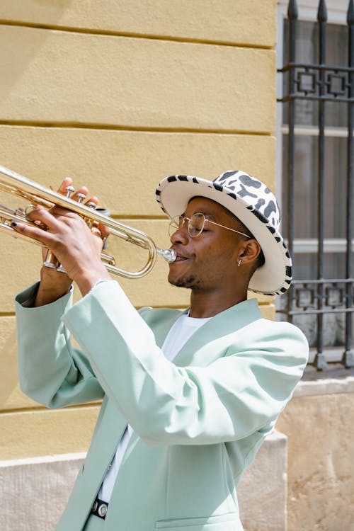 Man in Teal Suit Playing Trumpet