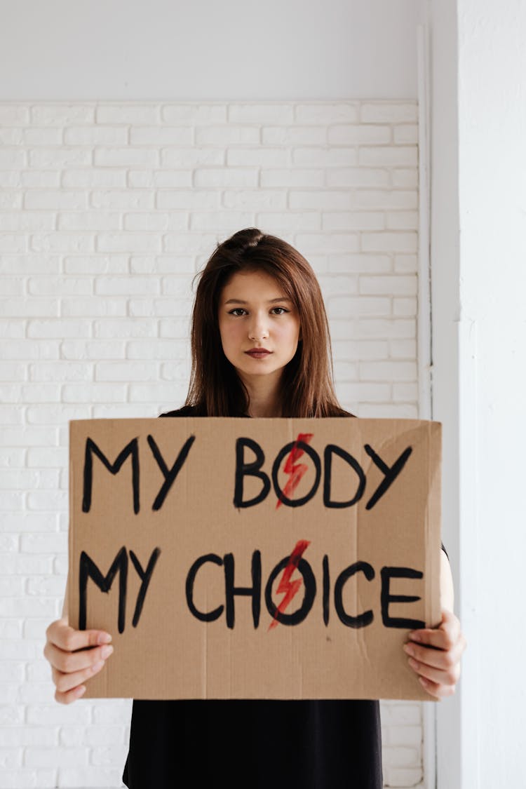 Girl Holding A Paperboard