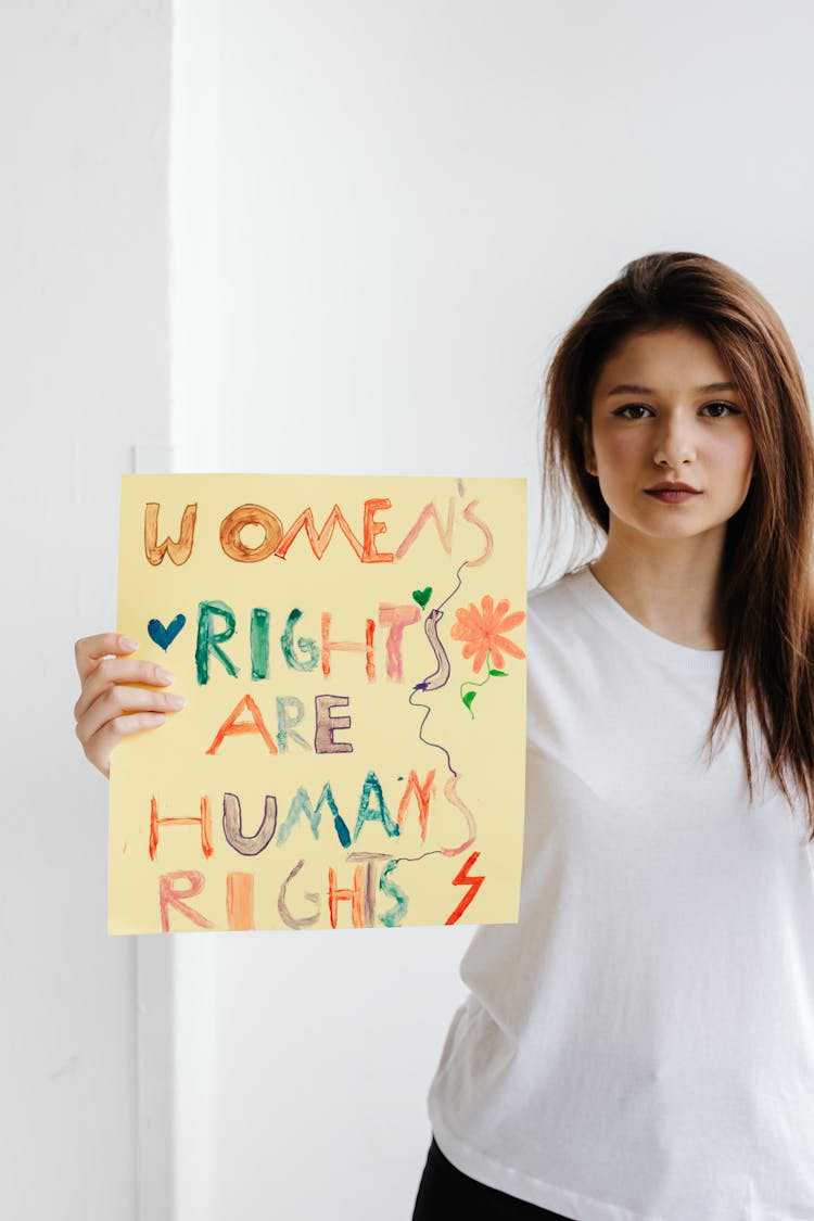 Woman Holding A Poster