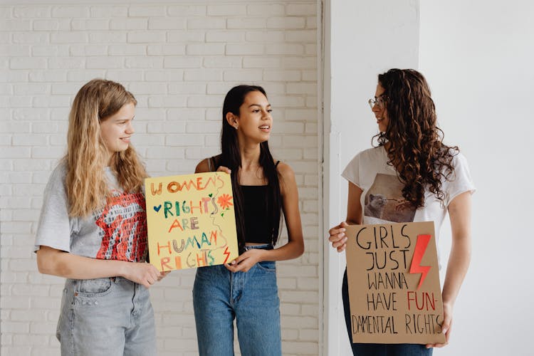 Photo Of Women Holding Posters