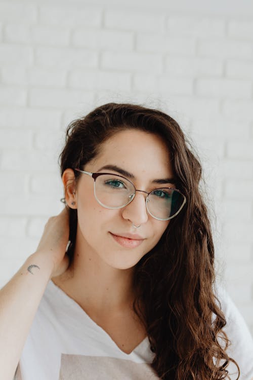 Woman in White Shirt Wearing Eyeglasses