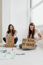 Woman in White Shirt Holding Brown Cardboard Box