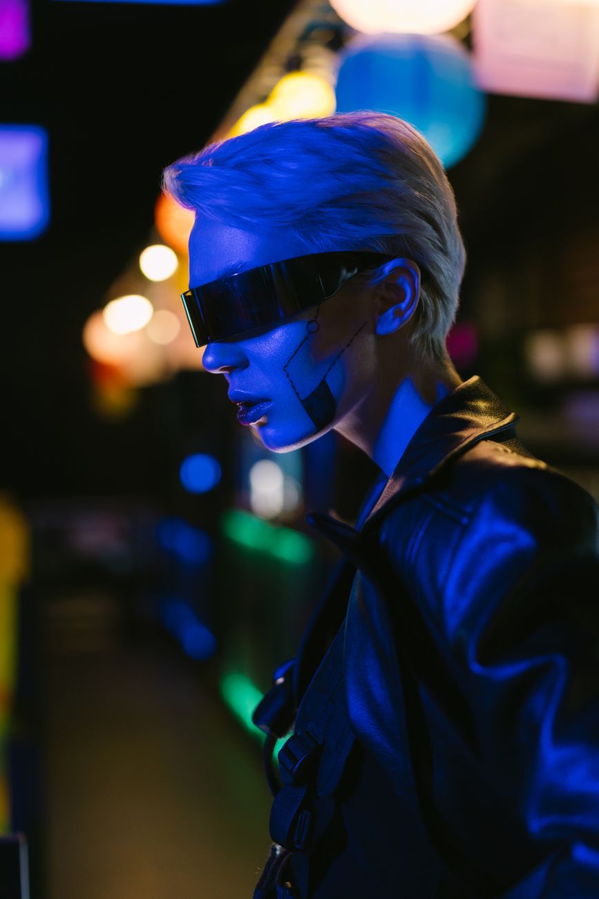 Explore a futuristic cyberpunk theme with a stylish person in vibrant lighting.