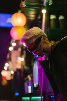 Stylish woman in futuristic cyberpunk attire with neon lights and eyewear.. stylish, woman, futuristic
