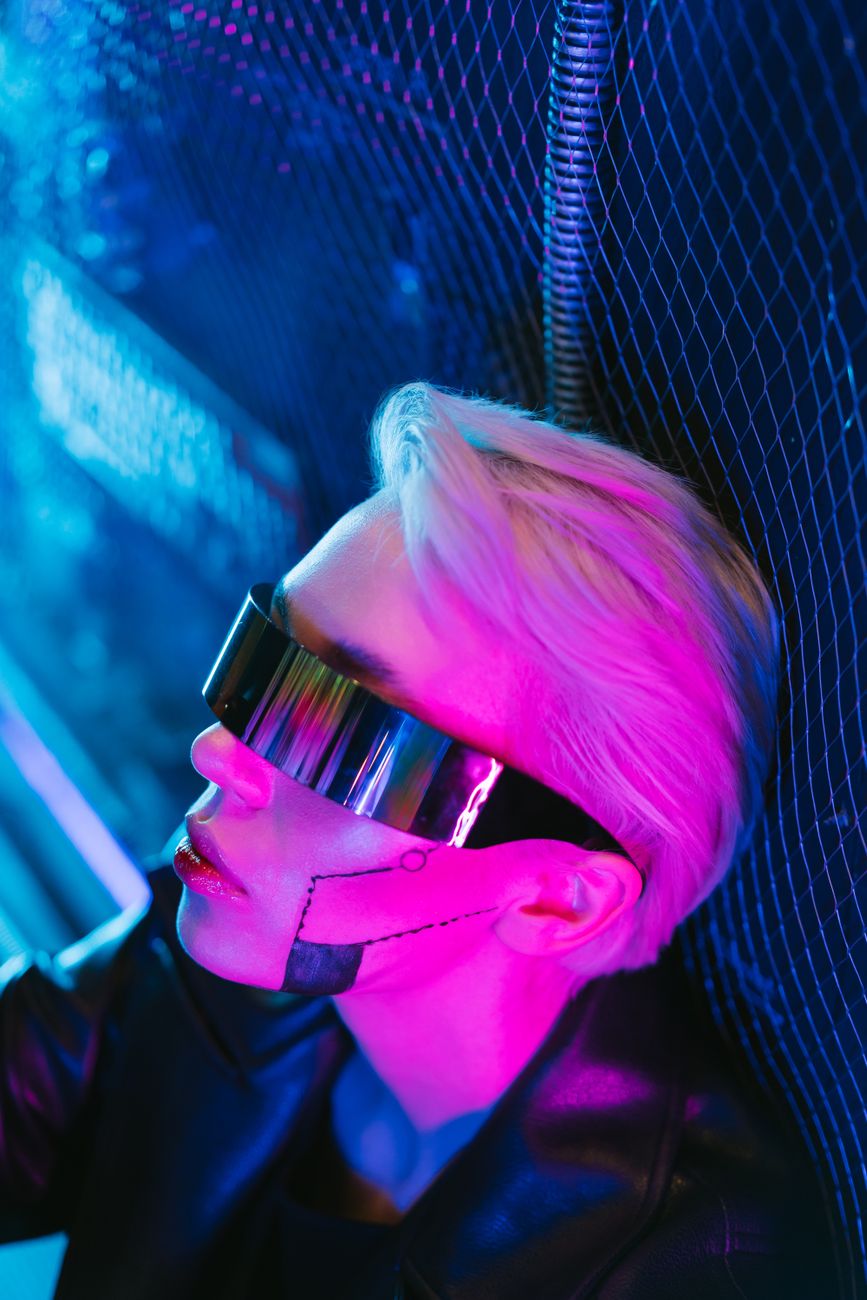 A futuristic portrait of a person with cyberpunk style and neon lighting.