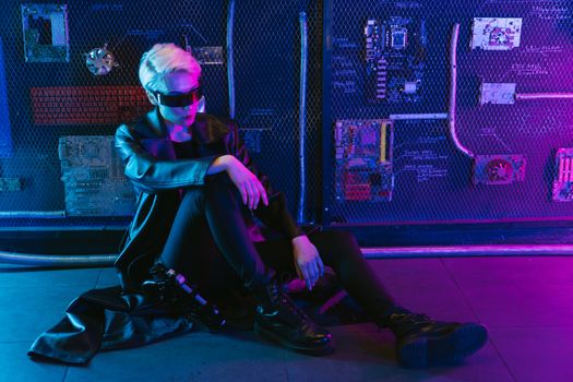Cyberpunk portrait featuring a person in a futuristic outfit with neon lighting.