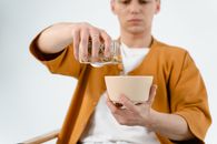 Man Pouring Cereals in a Bowl