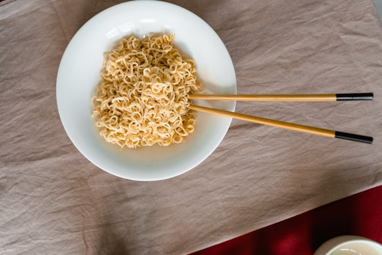 Flatlay Shot Of Pasta On White Ceramic Bowl