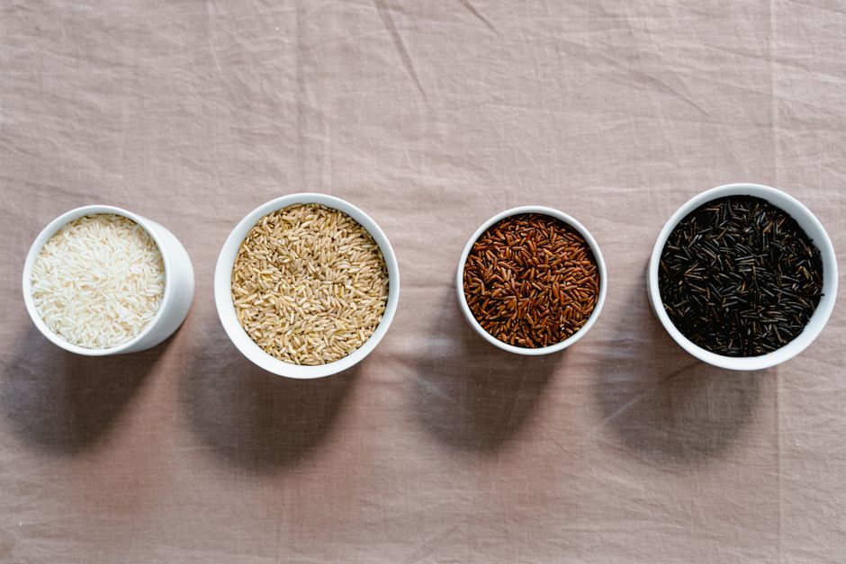 various raw rice varieties in bowls - cheap vegan rice dishes various raw rice varieties in bowls - cheap vegan rice dishes