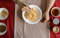 Person Holding White Ceramic Bowl With Pasta