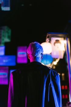 Cyberpunk fashion captured at night under vibrant neon lights, showcasing modern futuristic style.. pexels, cyberpunk, fashio
