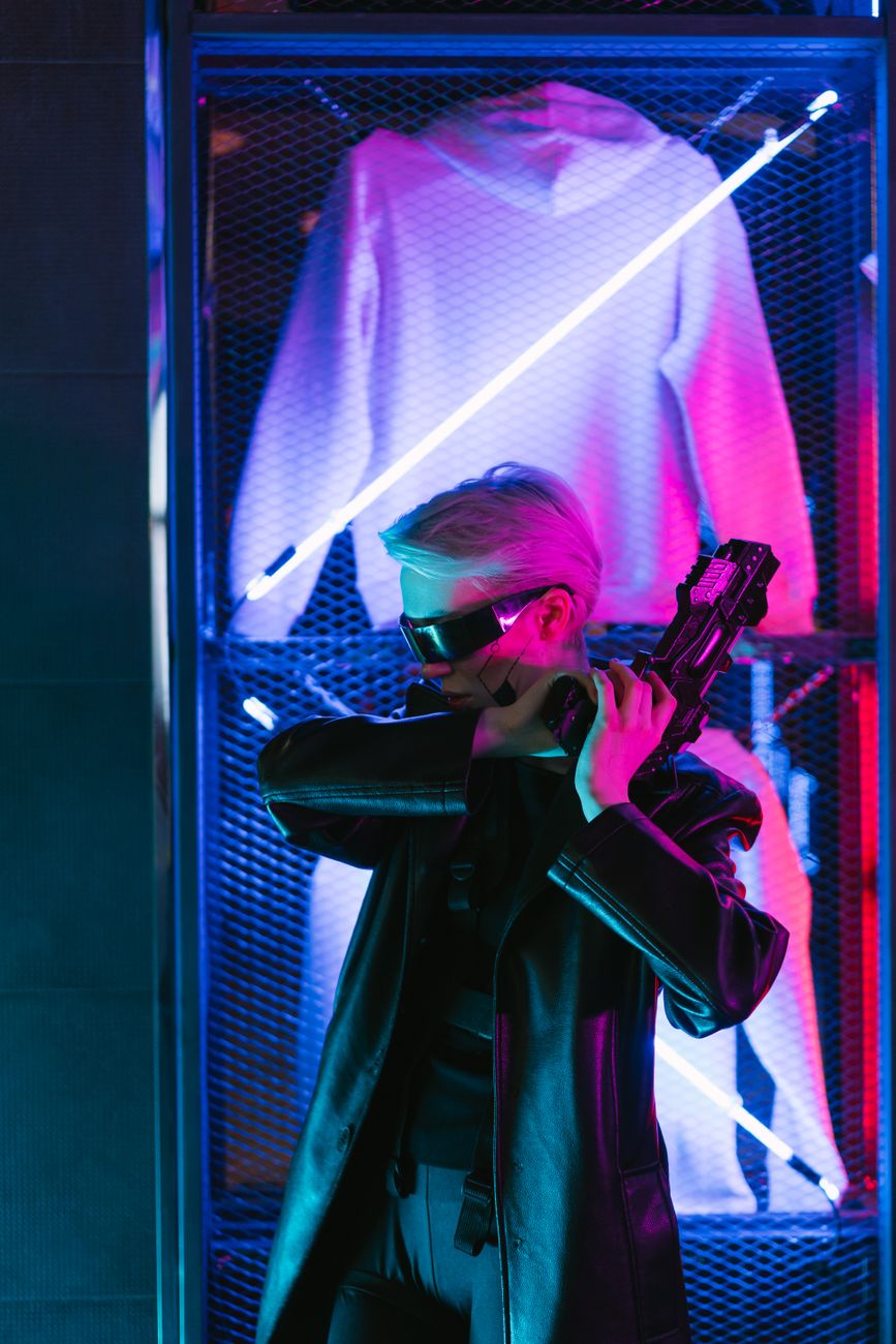 A futuristic woman in cyberpunk style with neon lights and a sci-fi weapon.