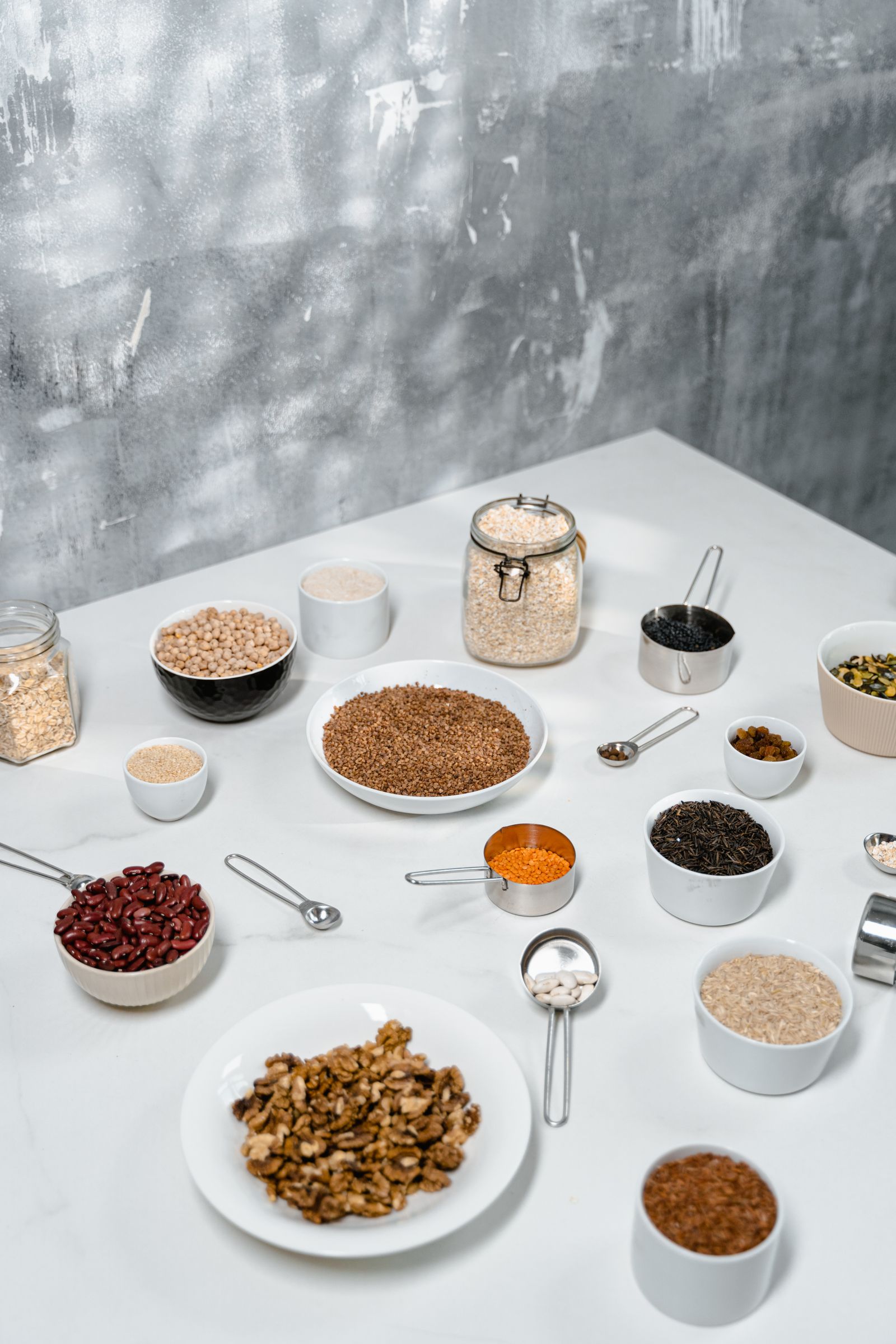 Small bowls of spices, seeds and pantry staples
