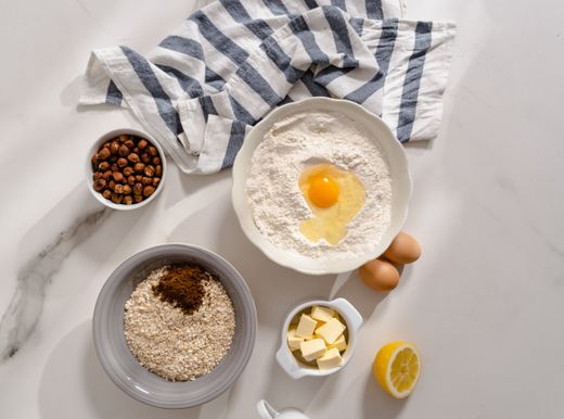 Baking ingredients on a marble counter — photo by MART PRODUCTION on Pexels