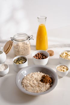 A nutritious breakfast setup with oats, nuts, and orange juice for a wholesome start.