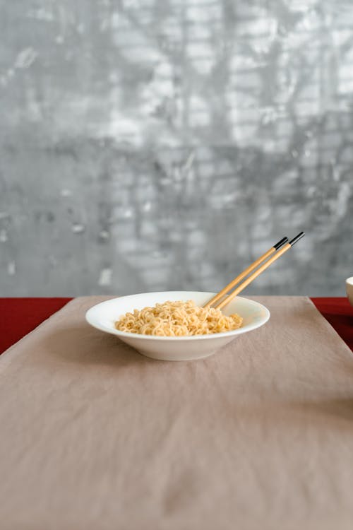 Photograph of a White Ceramic Bowl with Noodles